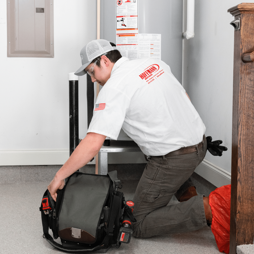 Hoffmann expert installing energy efficient water heater